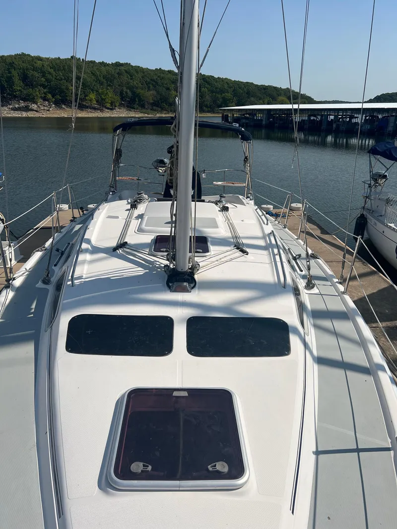 Slide: The Image of 2009 Hunter 36 sailboat docked at a marina. - 4