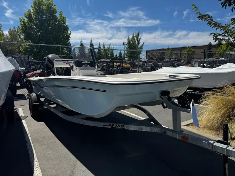 Slide: The Image of 2024 Mako Pro Skiff 17 CC boat on trailer in parking lot. - 4