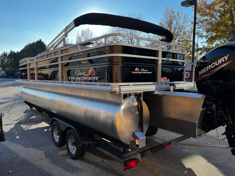 Slide: The Image of 2024 Sun Tracker Sportfish 24 XP3 pontoon boat with Mercury engine on trailer. - 4