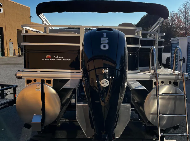 Slide: The Image of 2024 Sun Tracker Sportfish 24 XP3 pontoon boat with powerful outboard motor. - 5
