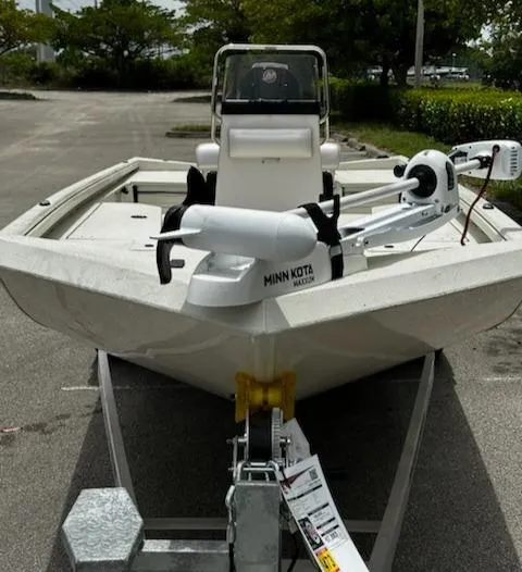 Slide: The Image of 2024 Ranger RB210 boat with Minn Kota trolling motor on trailer. - 2