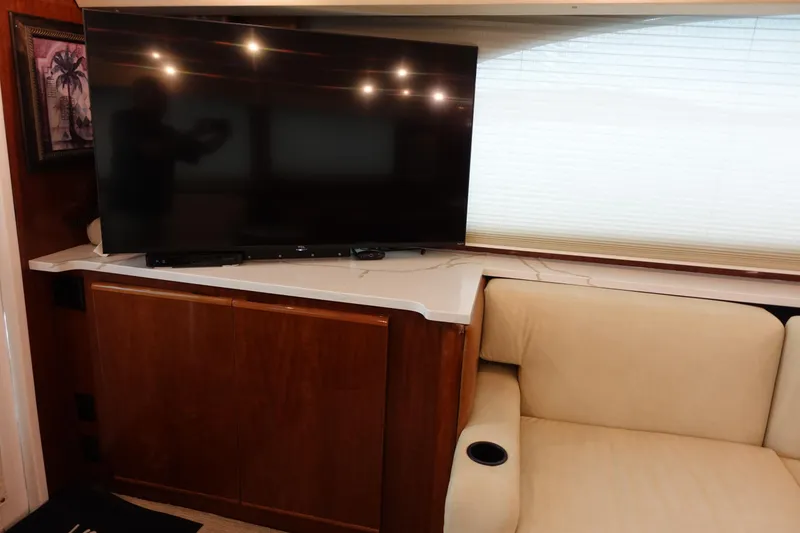 Slide: The Image of Interior of 1988 Donzi Z-65 Tournament Fisherman with TV, wooden cabinet, and beige seating. - 22