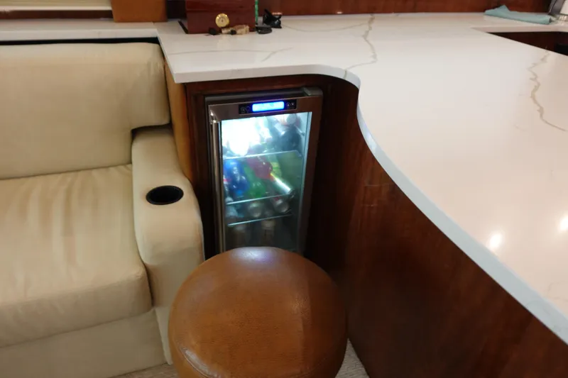 Slide: The Image of Interior of 1988 Donzi Z-65 Tournament Fisherman with mini fridge and seating area. - 23
