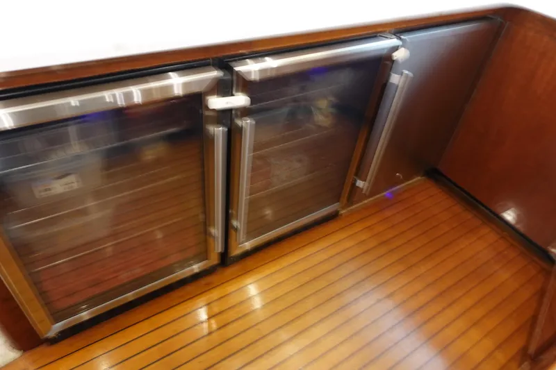 Slide: The Image of Wood-paneled interior with stainless steel appliances on a 1988 Donzi Z-65 Tournament Fisherman. - 27