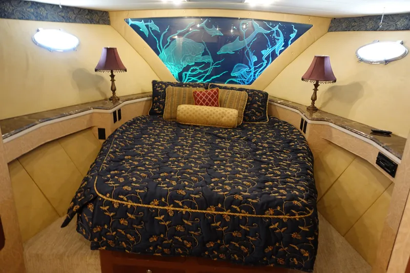 Slide: The Image of Luxurious cabin interior of 1988 Donzi Z-65 Tournament Fisherman with elegant bedding and decor. - 34