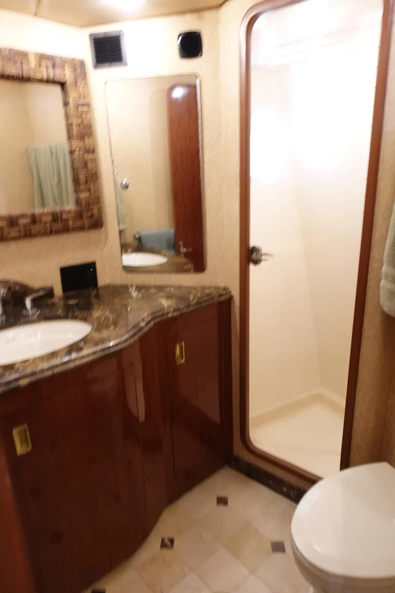Slide: The Image of 1988 Donzi Z-65 Tournament Fisherman yacht bathroom with shower, sink, and toilet. - 39