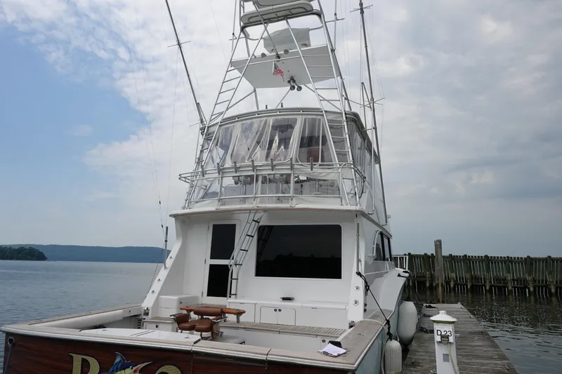 Slide: The Image of 1988 Donzi Z-65 Tournament Fisherman yacht docked by the water. - 4