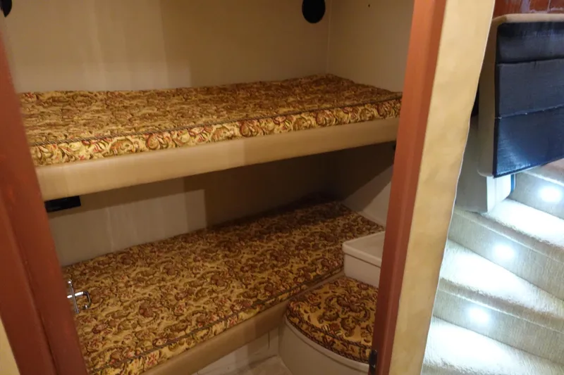 Slide: The Image of Interior of 1988 Donzi Z-65 Tournament Fisherman with bunk beds and patterned upholstery. - 43