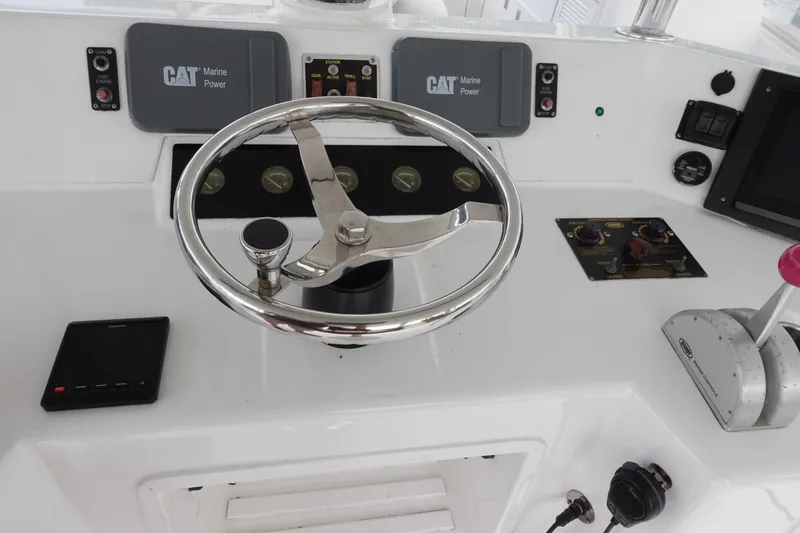 Slide: The Image of 1988 Donzi Z-65 Tournament Fisherman boat helm with steering wheel and controls. - 48