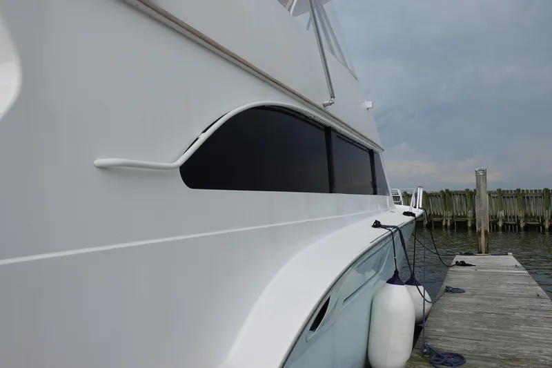 Slide: The Image of 1988 Donzi Z-65 Tournament Fisherman yacht docked, showcasing sleek design and elegant lines. - 6