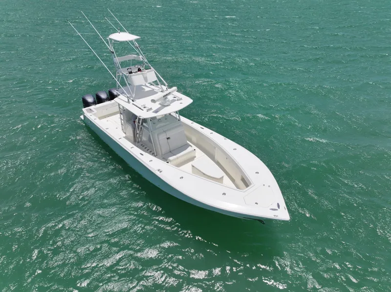 Slide: The Image of 2015 SeaVee 370z boat on open water with triple outboard engines. - 11
