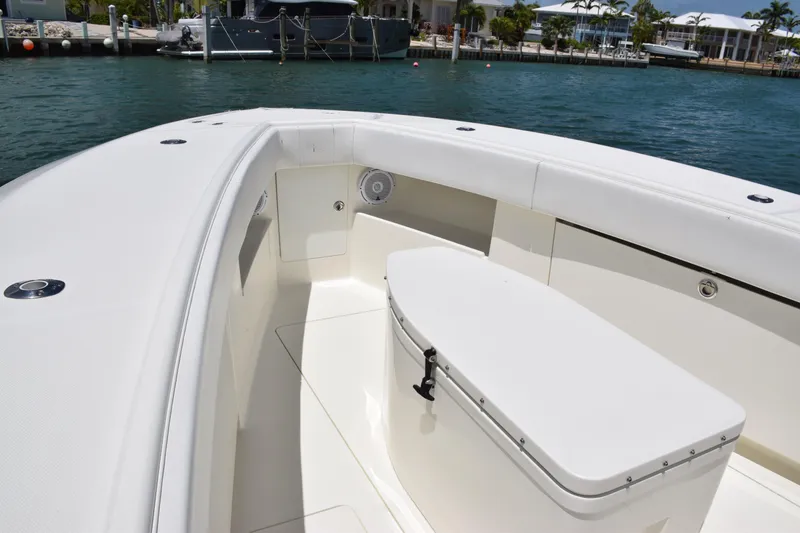 Slide: The Image of 2015 SeaVee 370z boat interior with white seating and storage. - 14