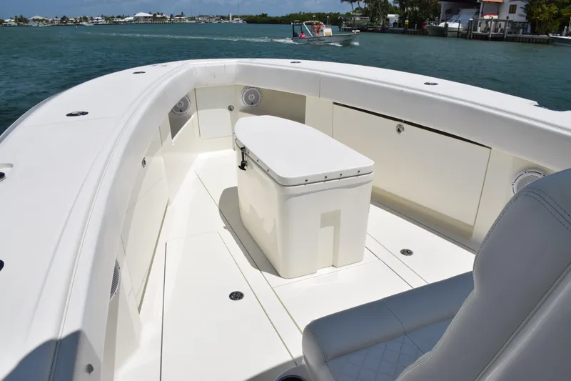 Slide: The Image of 2015 SeaVee 370z boat deck with seating and storage, cruising on a sunny day. - 16