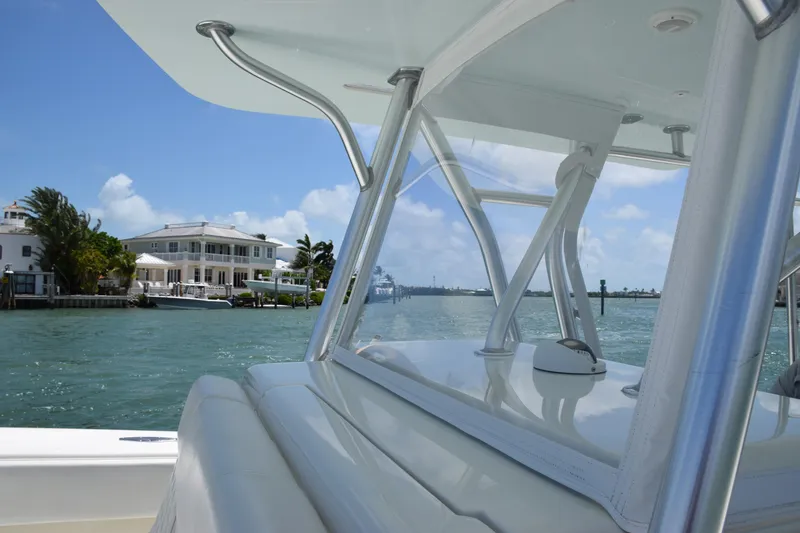 Slide: The Image of SeaVee 370z 2015 boat cruising near waterfront homes on a sunny day. - 19