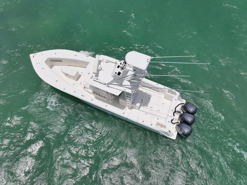 Slide: The Image of Aerial view of a 2015 SeaVee 370z boat on turquoise water. - 2