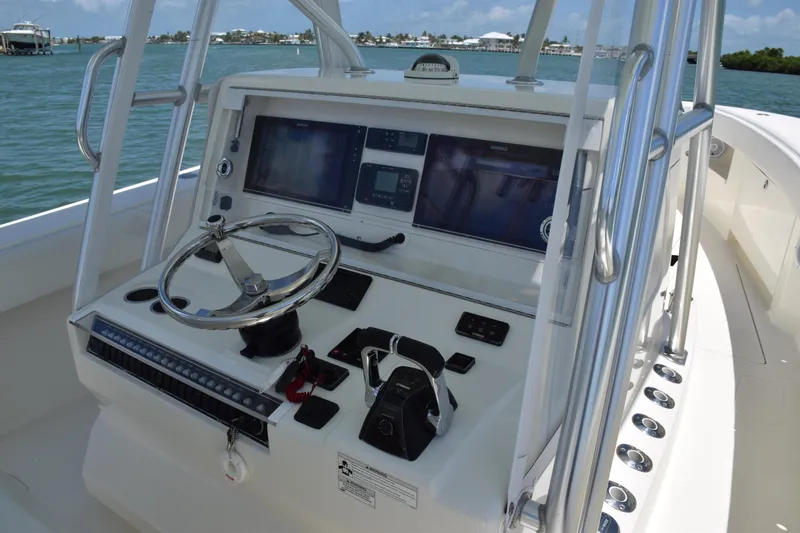 Slide: The Image of 2015 SeaVee 370z boat console with dual screens and steering wheel. - 23