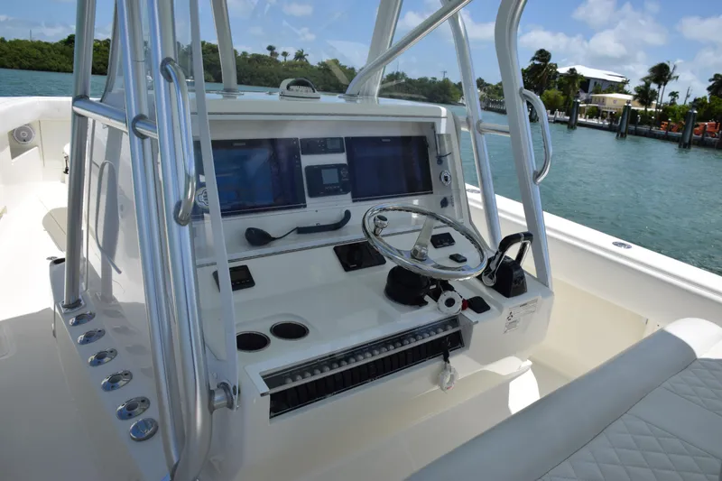 Slide: The Image of 2015 SeaVee 370z boat console with dual screens and steering wheel. - 25