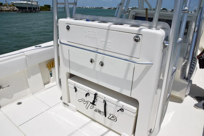 Slide: The Image of SeaVee 370z 2015 boat interior with storage compartments and cooler on deck. - 32