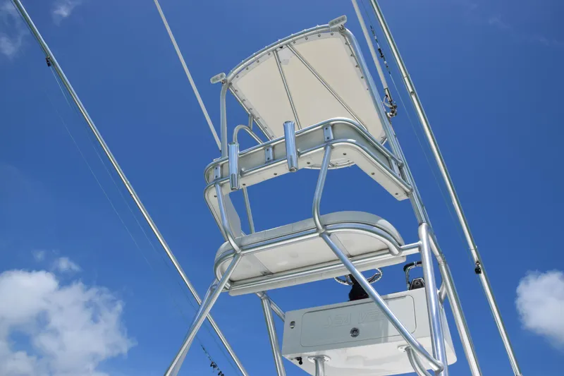 Slide: The Image of Tower seating on a 2015 SeaVee 370z boat against a clear blue sky. - 33