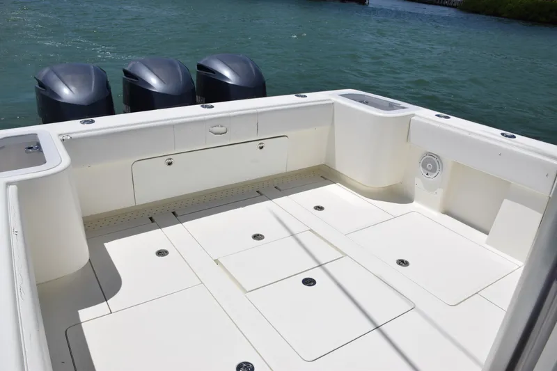 Slide: The Image of SeaVee 370z 2015 boat deck with triple outboard motors on water. - 36