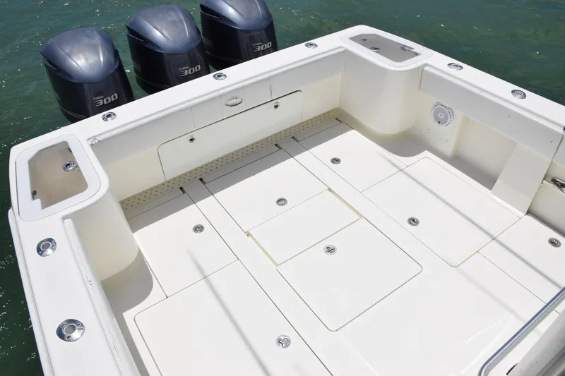 Slide: The Image of SeaVee 370z 2015 boat deck with triple 300 horsepower outboard engines. - 43