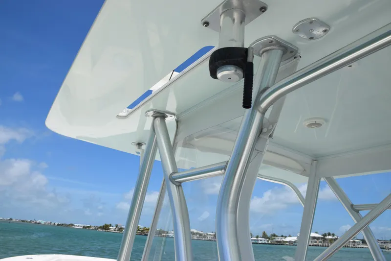 Slide: The Image of Close-up of 2015 SeaVee 370z boat's T-top structure against blue sky and water. - 44