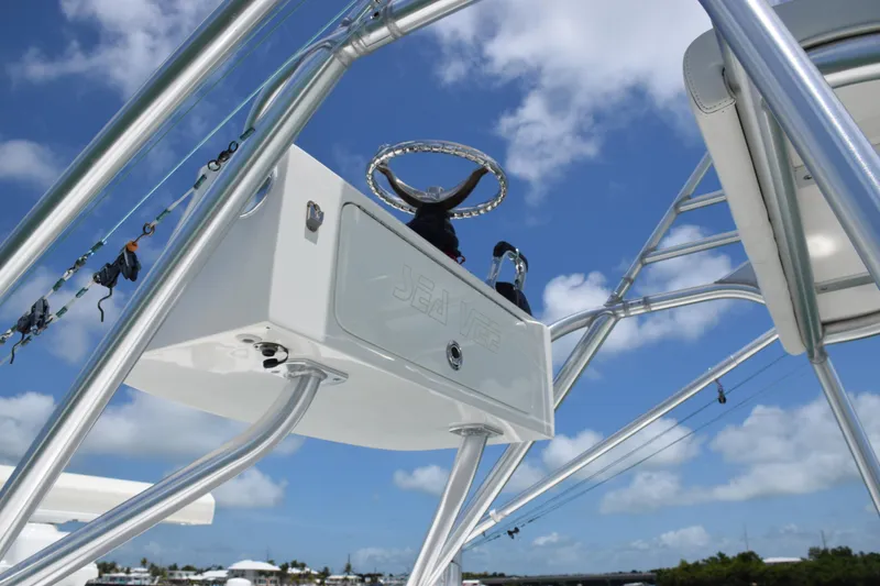 Slide: The Image of 2015 SeaVee 370z boat helm station with blue sky background. - 45