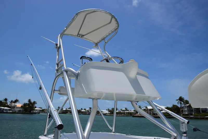 Slide: The Image of 2015 SeaVee 370z boat tower with controls and canopy on a sunny day. - 48