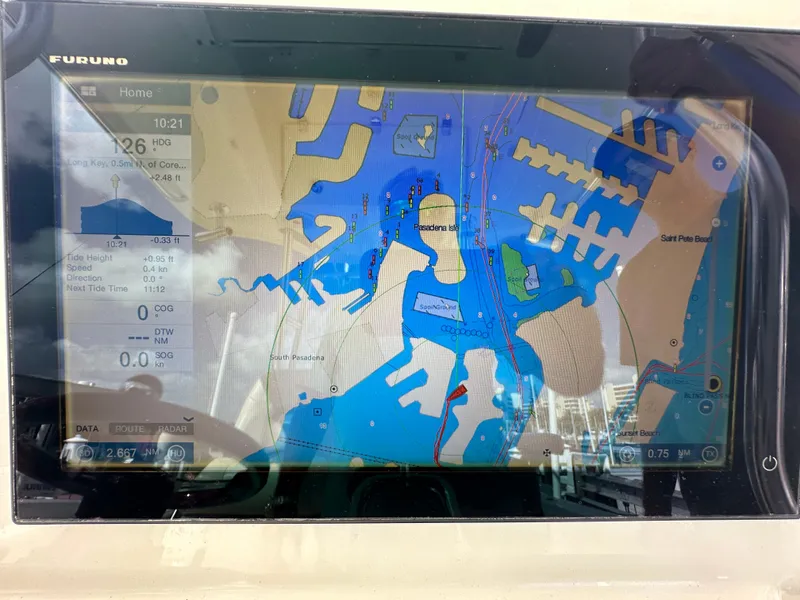 Slide: The Image of Furuno marine GPS display on a 2016 Cobia 296CC boat showing navigational map. - 19