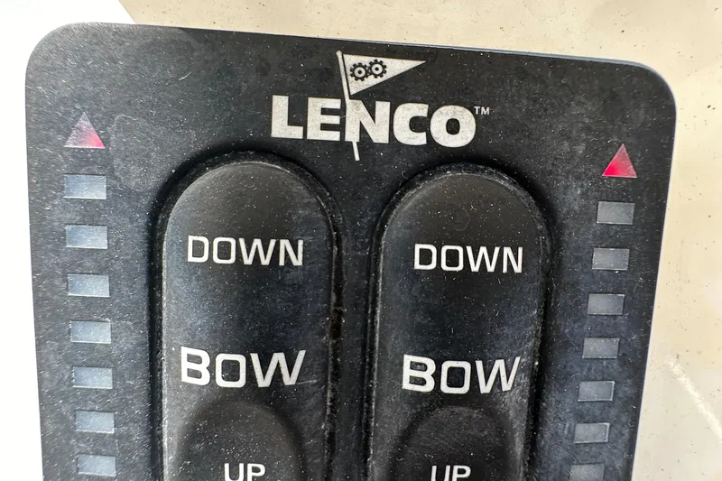 Slide: The Image of Lenco trim tab control panel on a 2016 Cobia 296CC boat. - 21
