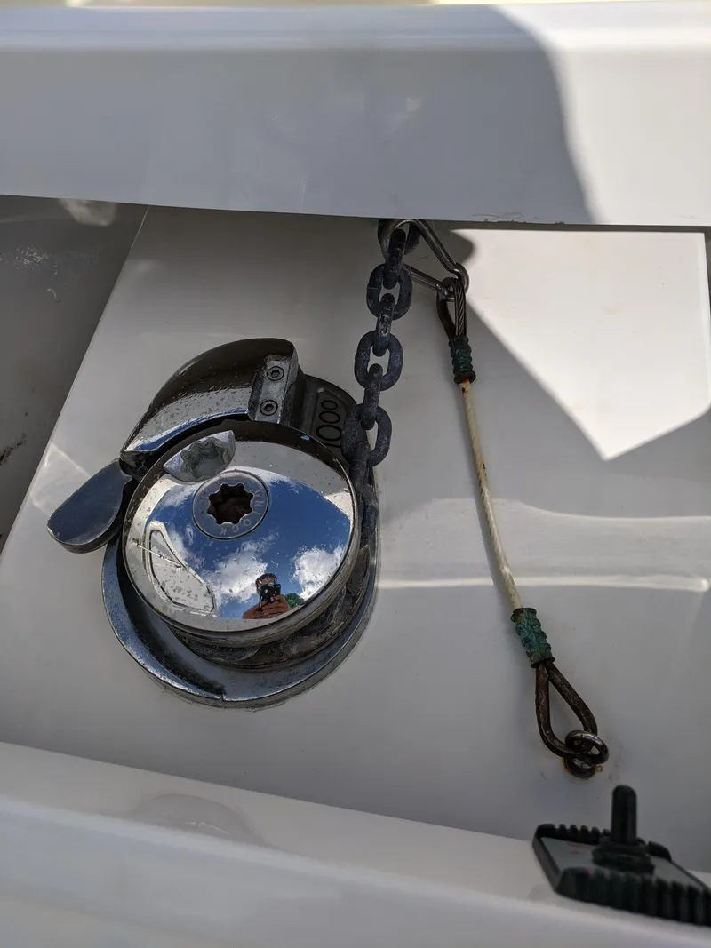 Slide: The Image of Anchor chain and windlass on a 2014 Invincible 42 Open Fisherman boat. - 10