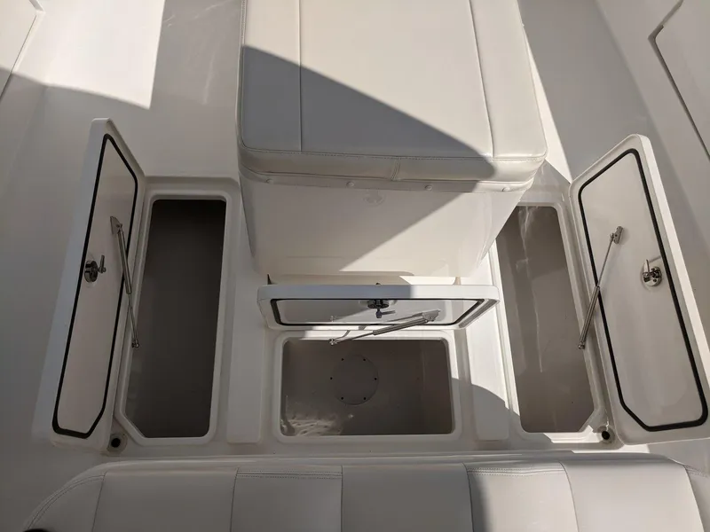 Slide: The Image of 2014 Invincible 42 Open Fisherman boat storage compartments. - 11