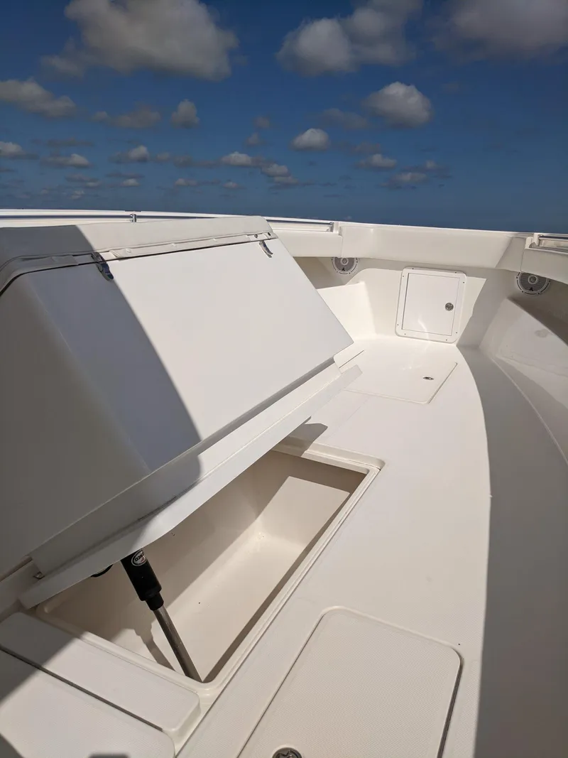 Slide: The Image of 2014 Invincible 42 Open Fisherman boat deck with storage compartments. - 13