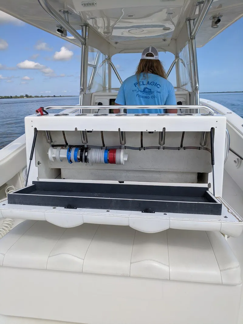 Slide: The Image of 2014 Invincible 42 Open Fisherman with fishing gear storage on a sunny day. - 16