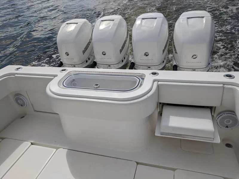 Slide: The Image of 2014 Invincible 42 Open Fisherman with quad outboard engines on water. - 18