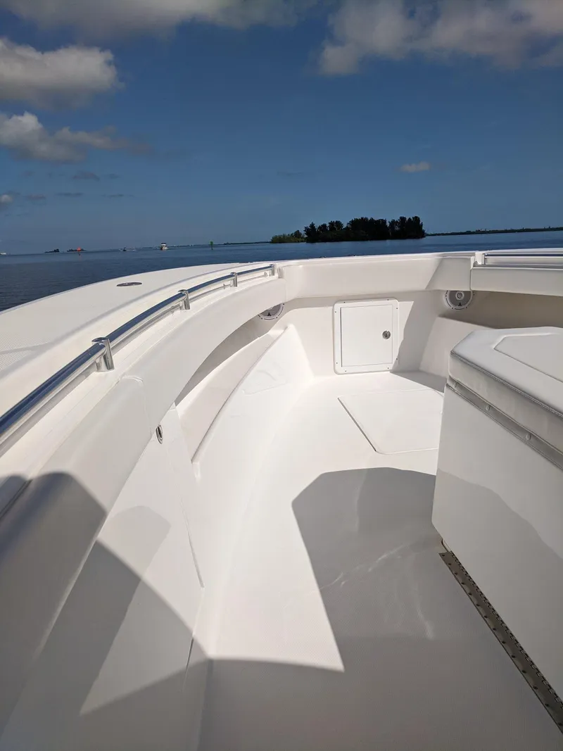 Slide: The Image of 2014 Invincible 42 Open Fisherman boat deck with ocean view. - 7