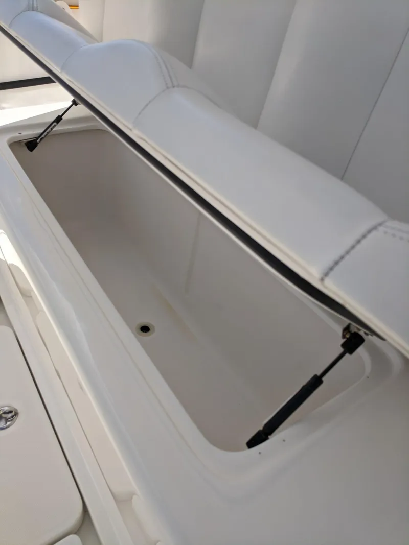 Slide: The Image of Open storage compartment on a 2014 Invincible 42 Open Fisherman boat. - 8