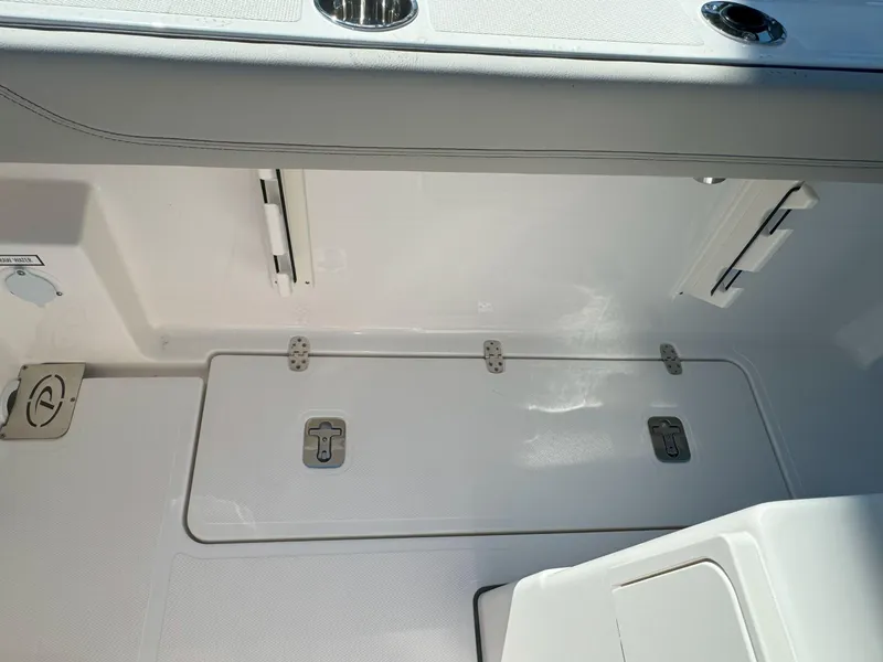 Slide: The Image of Open storage compartment in 2025 Pursuit S 248 boat. - 10