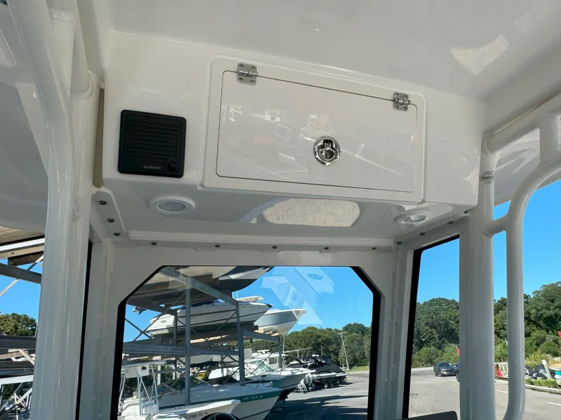 Slide: The Image of 2025 Pursuit S 248 boat console with steering wheel and control panel. - 19