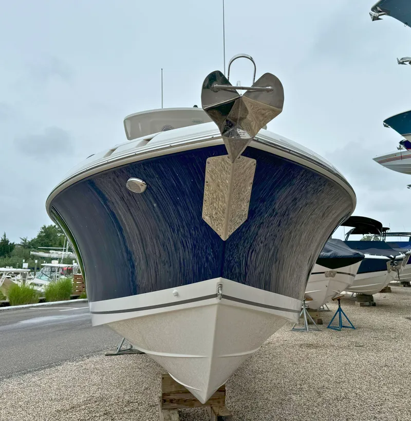 Slide: The Image of 2025 Pursuit S 248 Sport boat on trailer at Strong's Marine dealership. - 2