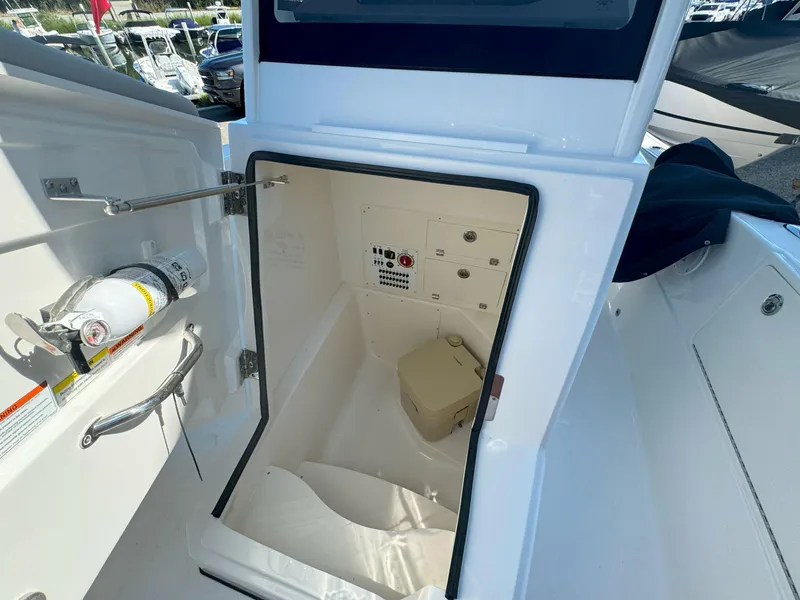 Slide: The Image of 2025 Pursuit S 248 boat bow with anchor, docked on a sunny day. - 24