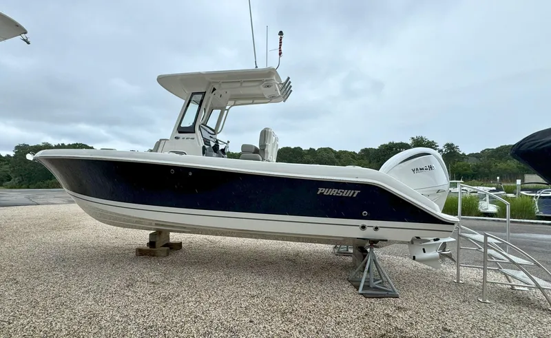 Slide: The Image of 2025 Pursuit S 248 Sport boat on trailer, featuring Yamaha engine and Strong's Marine branding. - 3