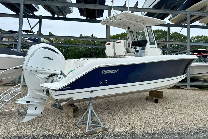 Slide: The Image of 2025 Pursuit S 248 boat with Yamaha 300 V6 engine, docked outdoors. - 4
