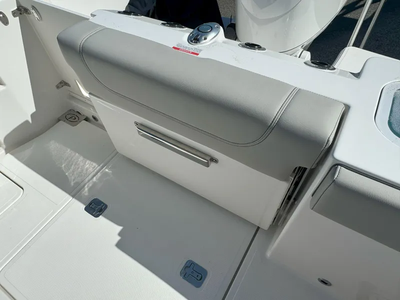 Slide: The Image of 2025 Pursuit S 248 boat interior with cushioned seating and modern design. - 7