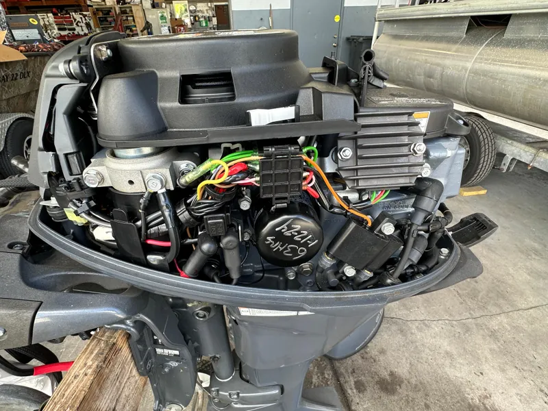 Slide: The Image of 2018 Yamaha Outboards F20LPA engine with exposed internal components in a workshop. - 10