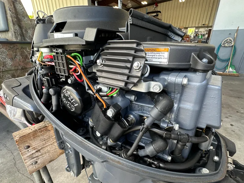 Slide: The Image of 2018 Yamaha Outboards F20LPA engine in a workshop setting. - 11