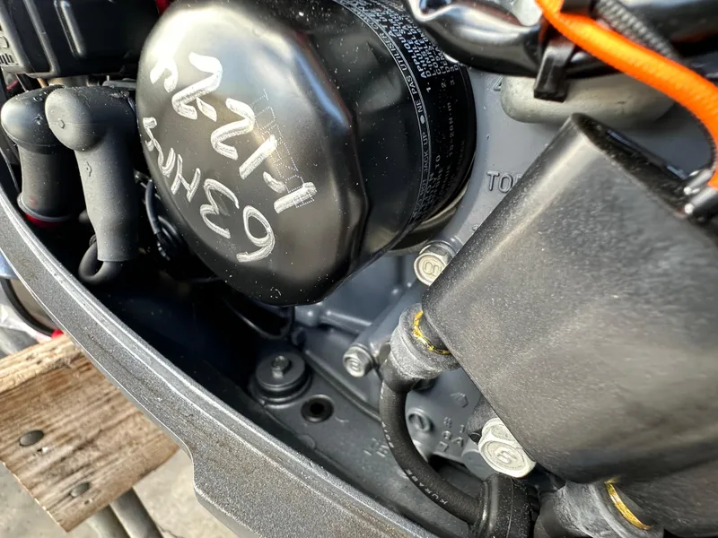 Slide: The Image of Close-up of 2018 Yamaha Outboards F20LPA engine components. - 12