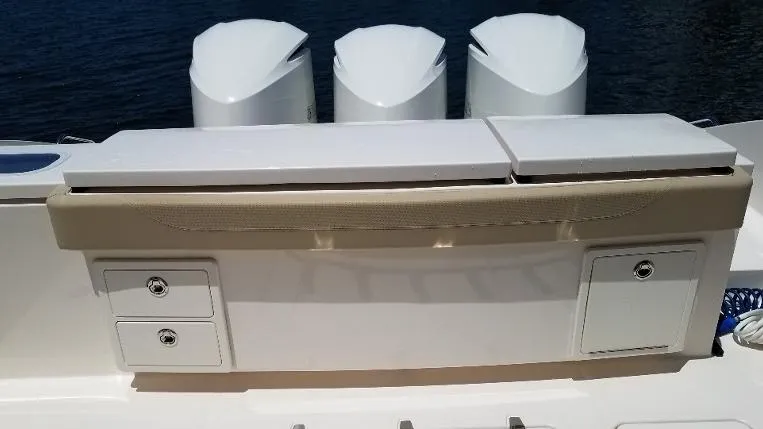 Slide: The Image of 2017 Pursuit S 408 Sport boat with triple outboard engines. - 20