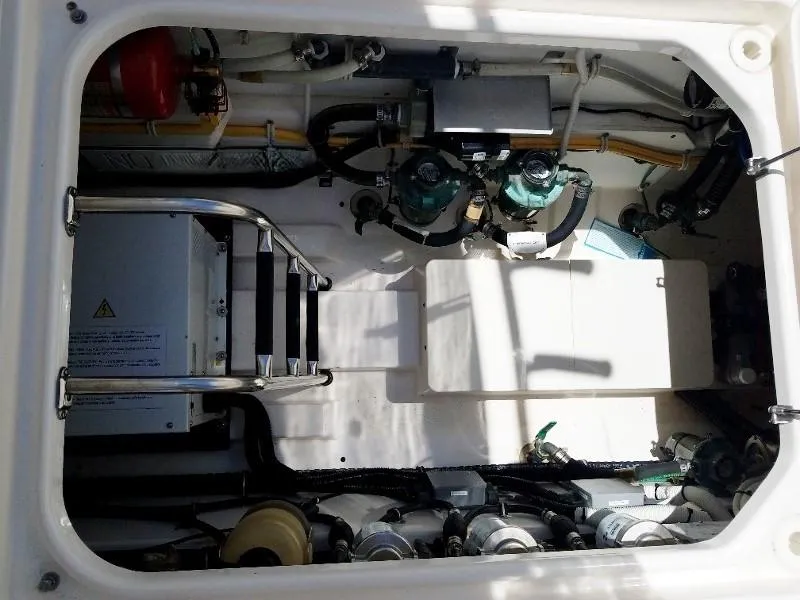 Slide: The Image of Engine compartment of a 2017 Pursuit S 408 Sport boat. - 26