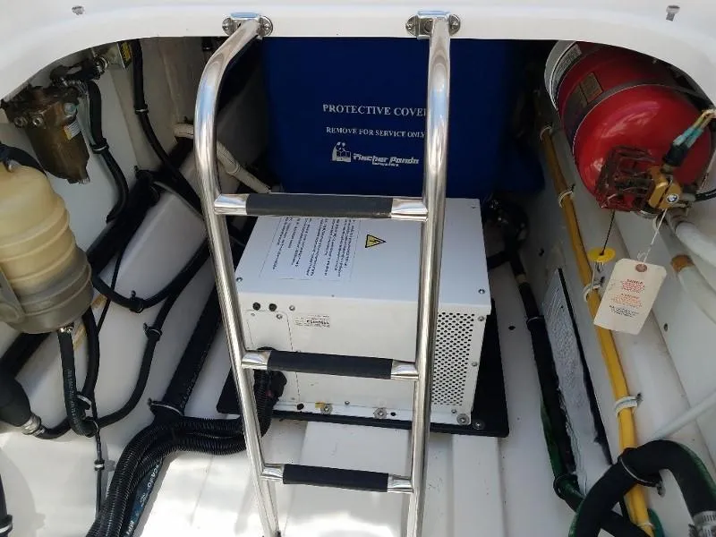 Slide: The Image of 2017 Pursuit S 408 Sport boat engine compartment with ladder and safety equipment. - 30